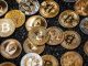 Picture of different crypto coins laying on top each other