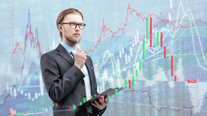 businessman trader analyst in glasses spectacles with notebook and thinking, on diagram background. Trading on stock exchange concept